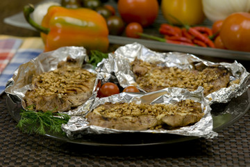 Steacks grilled on aluminium foil