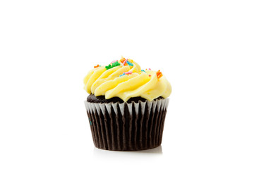 Yellow chocolate cupcakes on white