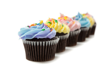 Pastel cupcakes on a white background