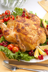 Whole roasted chicken on table