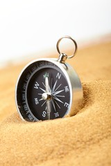 compass in sand