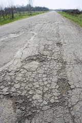 a large pothole on a country road