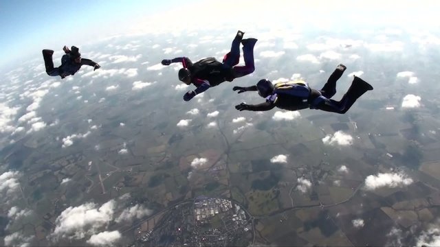 Three skydivers in freefall