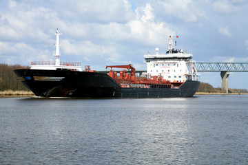 Oil tank. Ship with cargo on the Kiel Canal, Germany.