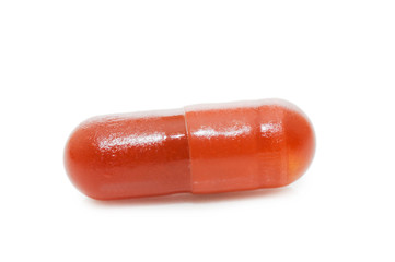 Red pill isolated on white background