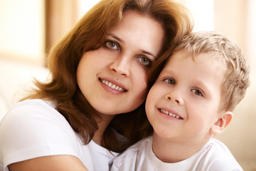 mother hugging her little son