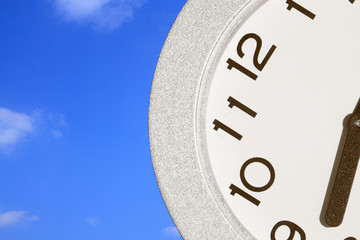 Clock in front of blue sky