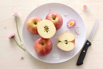 fresh red apples on a plate