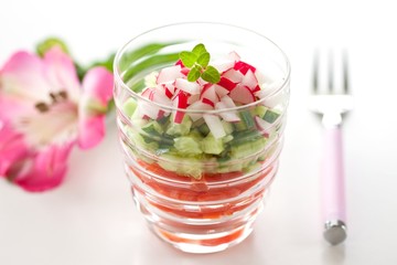 Fresh radish and cucunber salad in glass