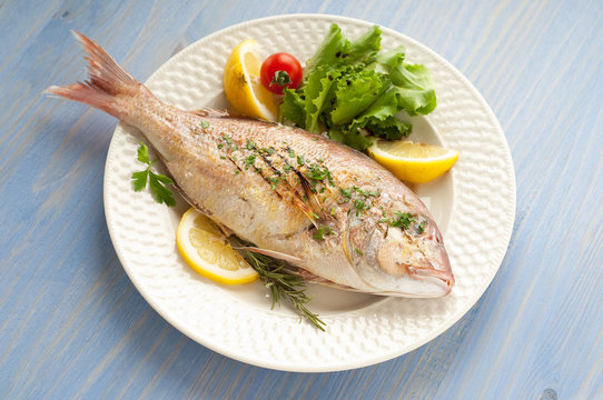 Grilled Red Snapper With Salad On Dish