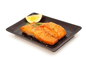 Grilled salmon with lemon isolated on white
