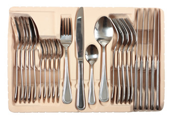 Cutlery set into packing isolated on white with clipping path