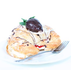 Cream filled croissant with chocolate strawberry