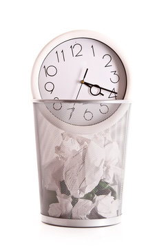 Clock in trash, lost time concept
