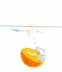 Fototapeta na wymiar Orange splash in water