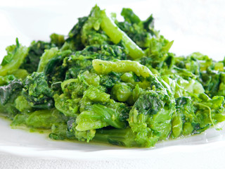 Boiled turnips on white dish.