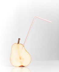 sliced pear with drinking straw