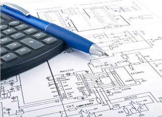 Calculator and pen on electrical diagram