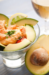 shrimp cocktail with avocado and glass of wine