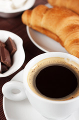 Black coffee and croissants