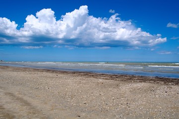 Sea landscape with blue sky and fluffy clouds