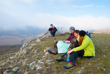 Hikers sit on the peak