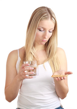 Woman holding contraception pills