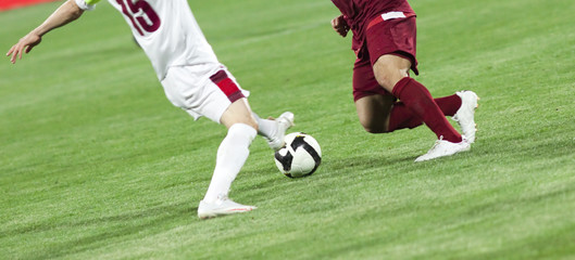 Obraz premium Soccer players running after the ball