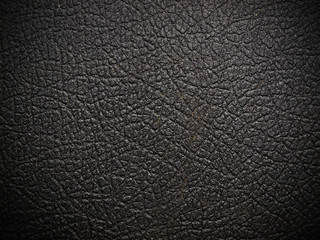 shiny black leather background close up
