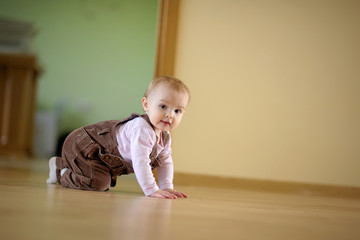 Adorable crawling baby girl