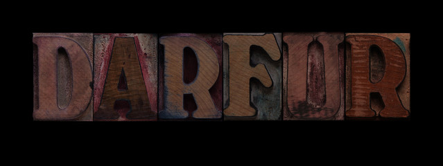 the word Darfur in old wood type