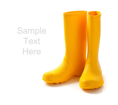 Yellow Rainboots On White With Copy Space