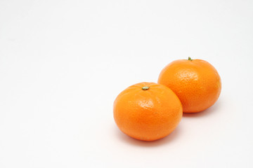 Two small Mandarin oranges.