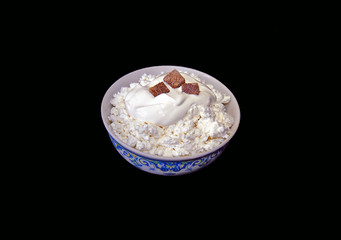 Bowl with curd and cane sugar