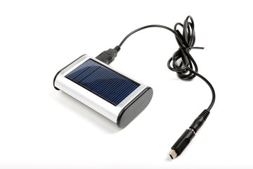 Solar charger for mobile phones isolated on white.