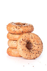 Stack of multi-seeded bagels with focus on front one