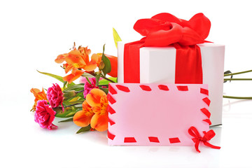 Fototapeta premium Orange lily and gift box on a white background