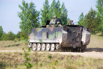 Fototapeta premium M113 troop-carrier awaiting orders to engage
