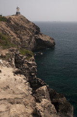 Fototapeta na wymiar Lighthouse on the cliff