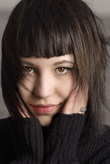 black hair young woman portrait, studio shot