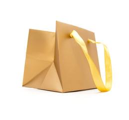 Gift package of gold colour on a white background