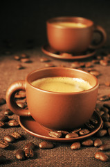 Cups of coffee and coffee beans