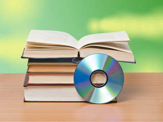 open book  and DVD disk as symbols of old and new methods of inf