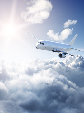Fototapeta Airplane in the sky - cloudy but sunny day