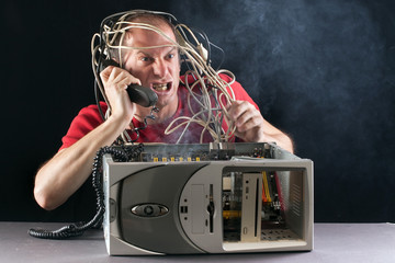 angry man and computer burning