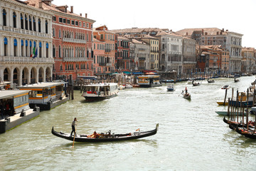 Fototapeta na wymiar Gondolas floating on the canals of Venice