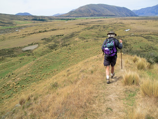 Hiker walking the hills of New Zealand