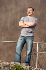 Young man full body portrait outdoors