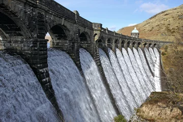 Printed roller blinds Dam Craig Goch dam overflowing with water, Elan Valley Wales.