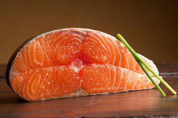 raw salmon on wood table